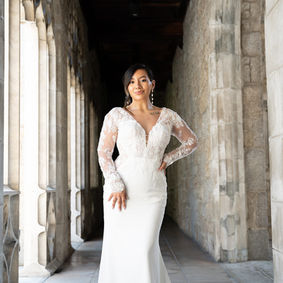 Sexy and sheer, Style D3912 exudes modern elegance with its figure-hugging column silhouette and combination of lace appliqué and 3D floral embellishments. Elegant floral lace long sleeves attach to a sheer bodice where a deep V-neckline and dramatic low back detail showcase the figure. Intricate 3D florals and lace appliqués bloom across the gown, trailing just past the hip to reveal a luxurious matte crepe skirt. The finishing detail is a showstopping long shaped train edged in beautiful lace that will capture every eye on that momentous walk down the aisle.