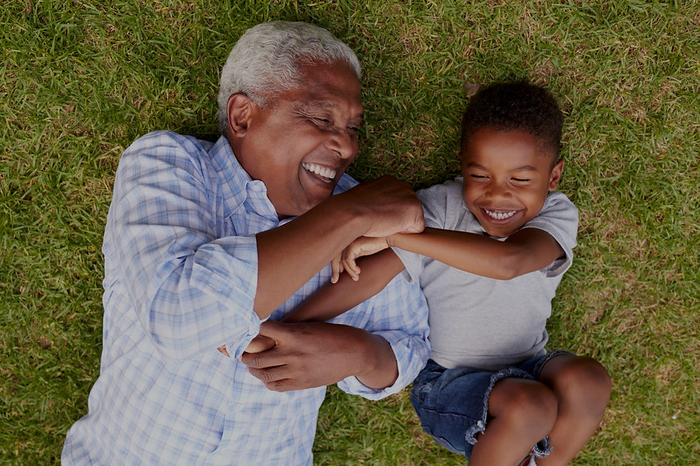 Grandfather and boy smiling_edited.jpg