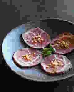 USDA Prime Ribeye Tataki with Ponzu and Japanese Cherry Blossoms.