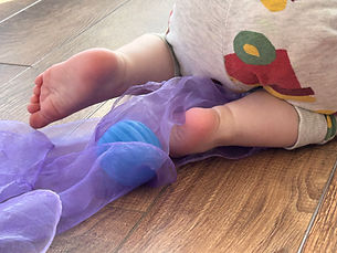 Baby crawling over material