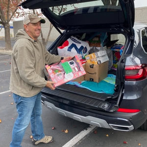 John Lillich sorting gifts