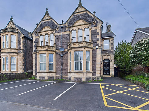 Victorian building with parking for brain injury rehabilitation services and facilities.