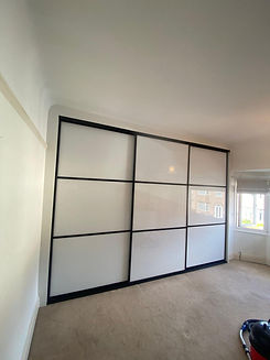 Architectural blueprints and design plans with samples of wood flooring and fabric.