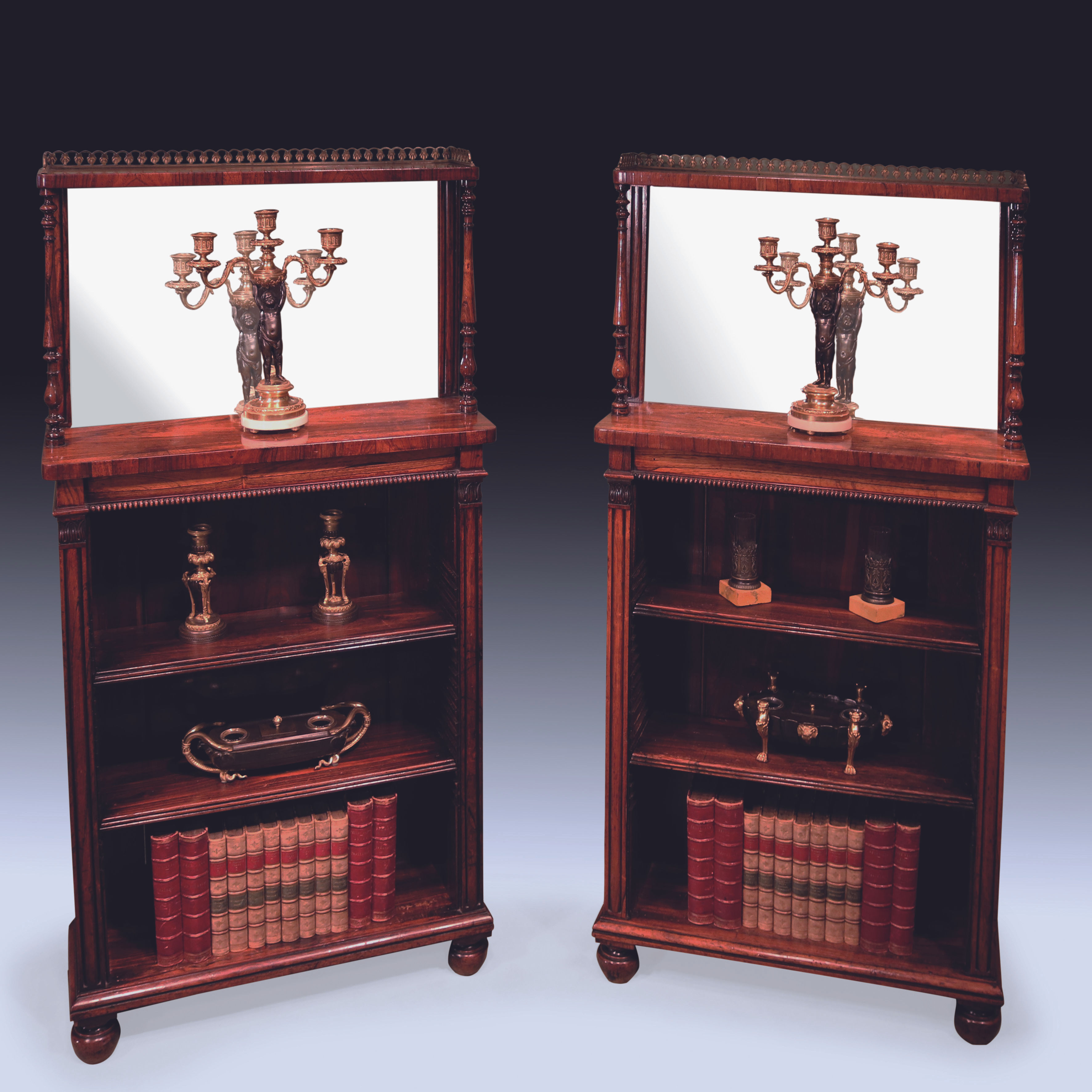 A pair of Regency period rosewood open bookcases