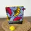 Miniature : Trousse wax fleurs de mariage rouge et jaune vue de face avec une fleur jaune