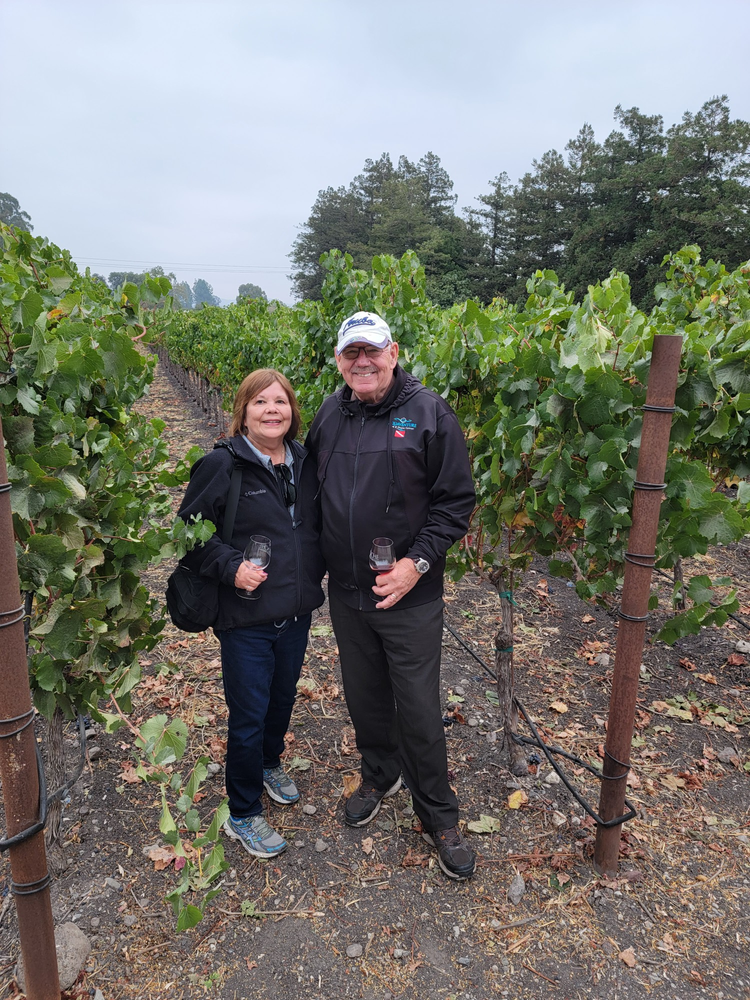 People standing in front of a winery