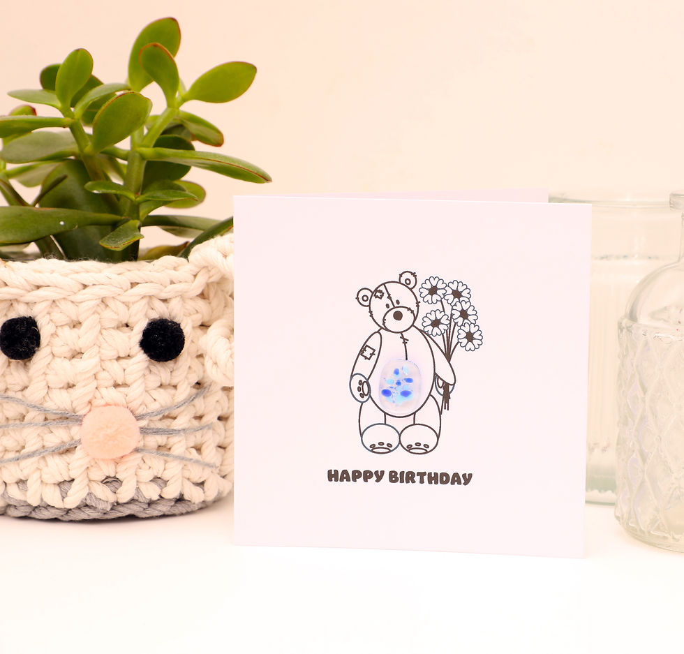 Teddy bear holding bouquet of flowers happy birthday card front view