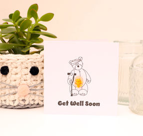 Discover our Teddy bear on crutches get well soon card, featuring beautiful fused glass. Send heartfelt wishes with this handmade card today!