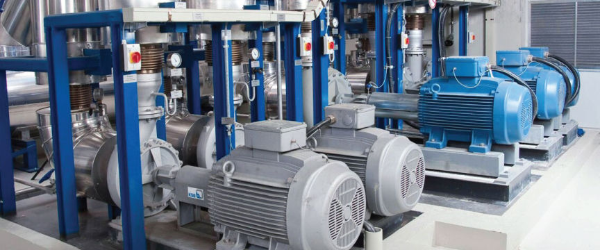 Water pumps and motors installed in a pump station.