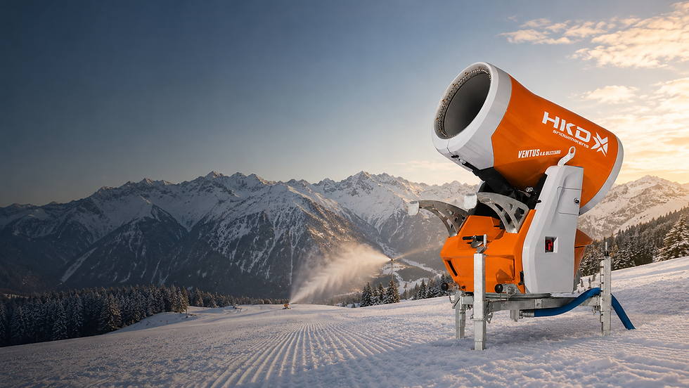 HKD snowmaker spraying snow on a mountain slope at sunset.