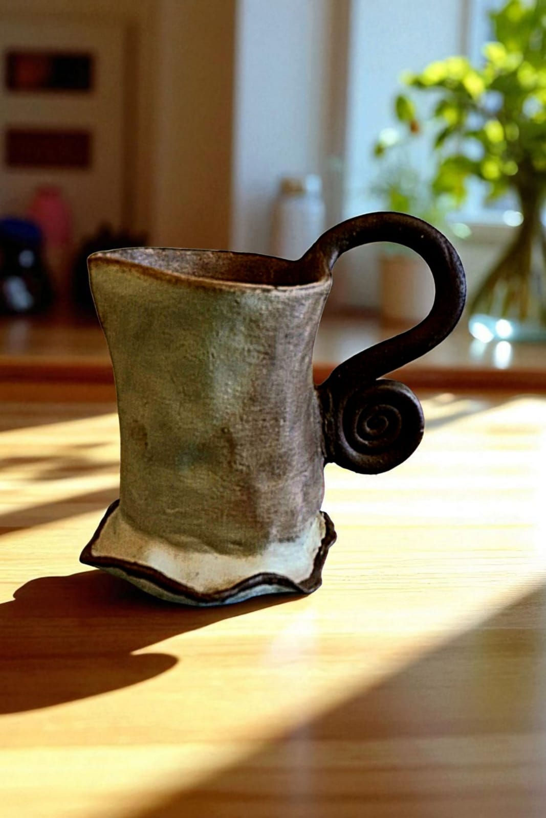 Handcrafted ceramic mug with textured surface and natural finish