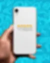 White smartphone with a sticker that says "WANTED" with five yellow stars below it.