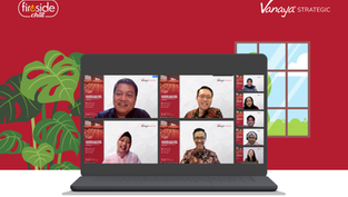 Laptop screen showing a virtual meeting with smiling participants. Red background with Vanaya Strategic and Fireside Chat logos. Lush green plant.