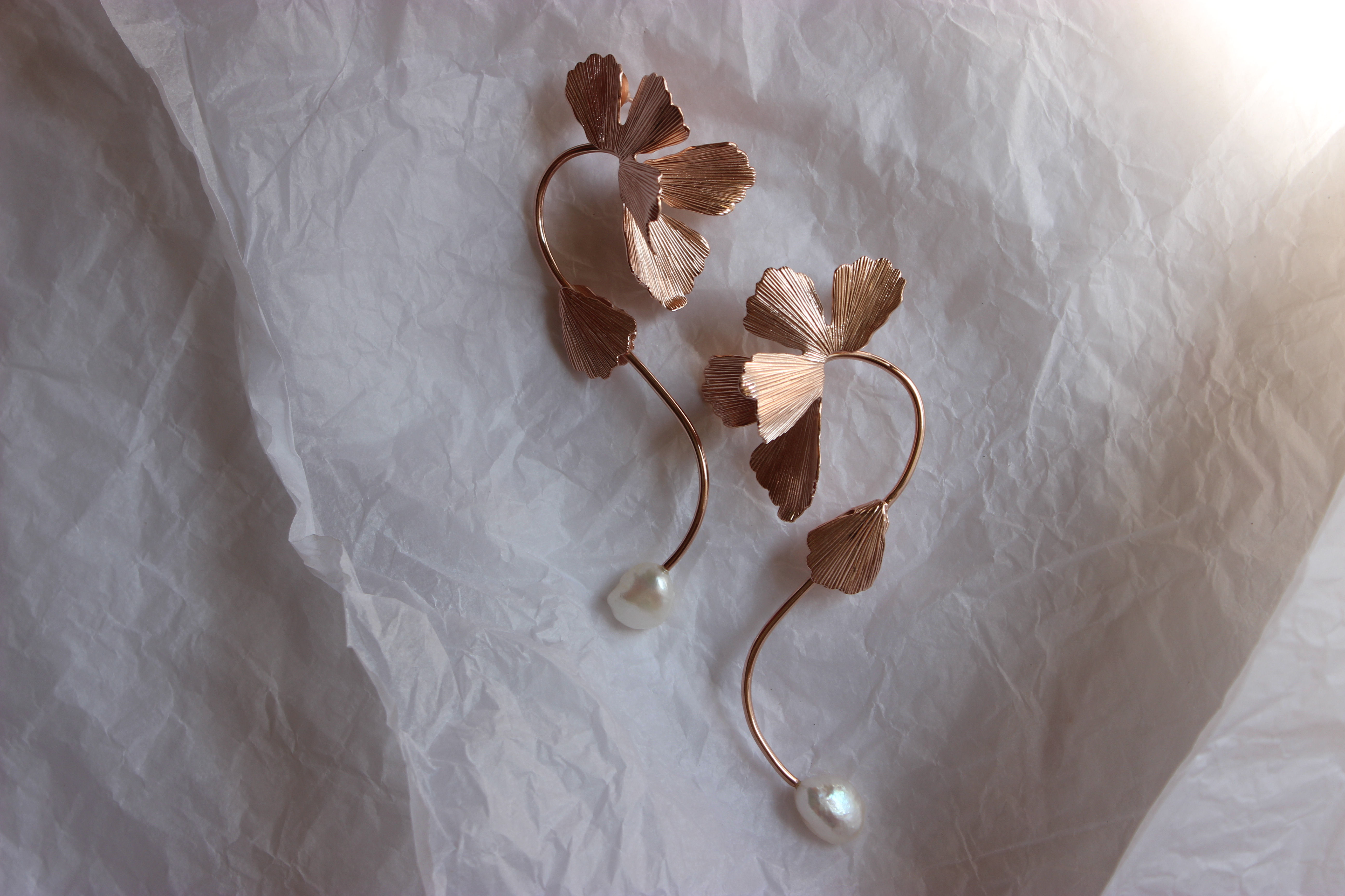 Elegant orchid-shaped earrings inspired by blooming flowers — floral statement jewelry with delicate petal details, perfect for nature-inspired or botanical fashion trends