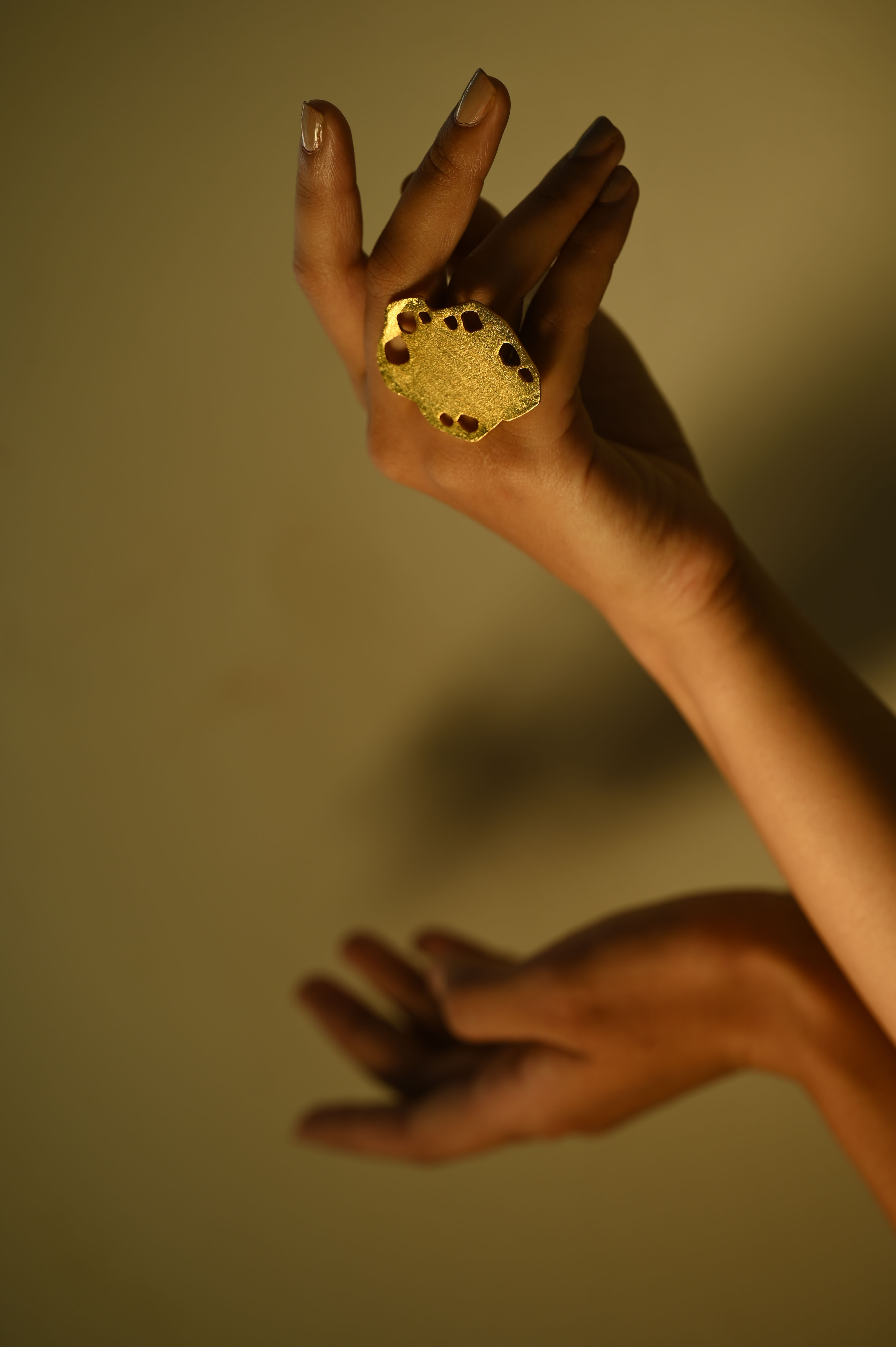Quirky cheese-inspired ring featuring a yellow wedge design with hole details – playful and unique fashion accessory