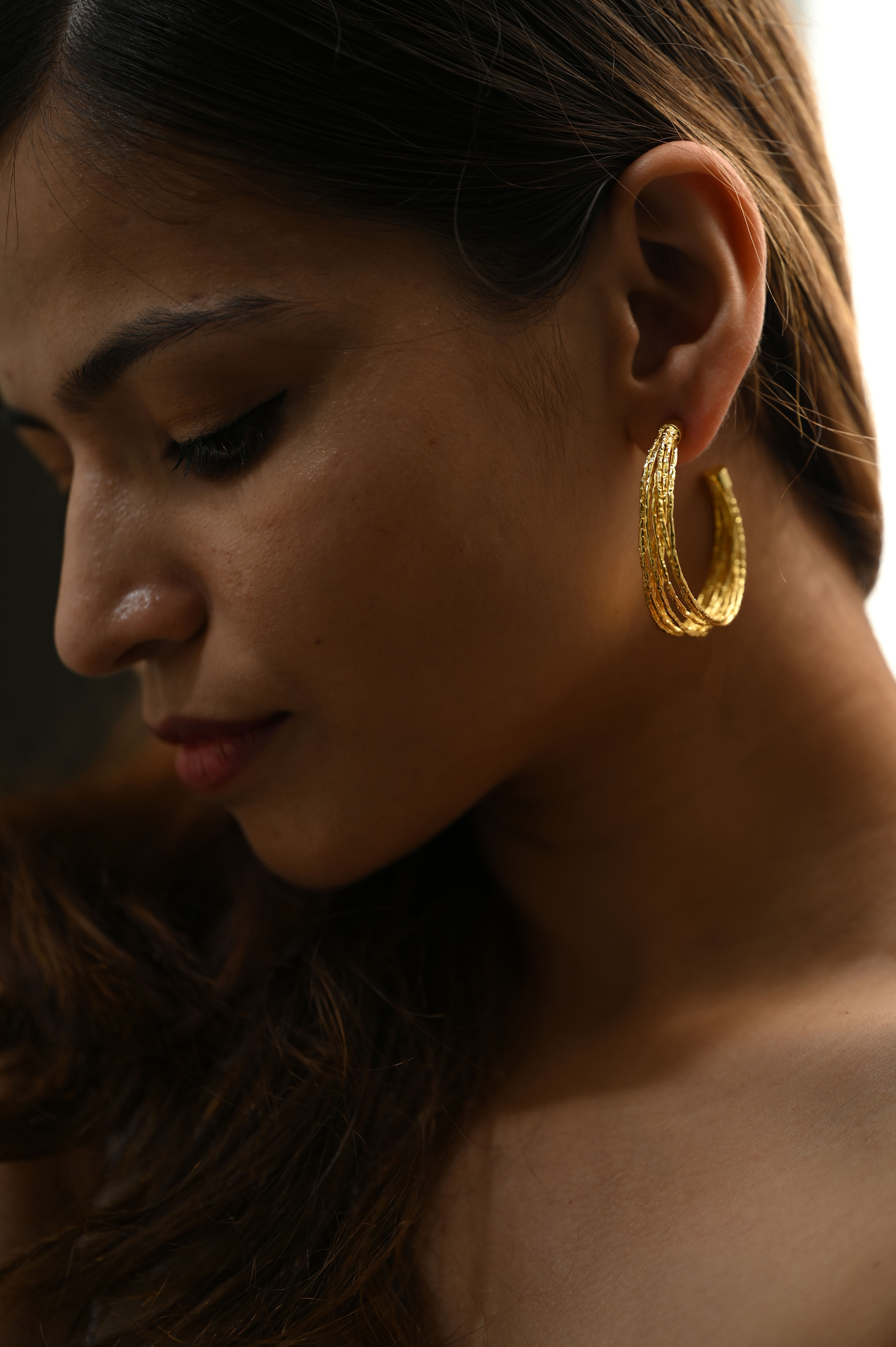 Stylish multiple-wired hoop earrings with a modern, layered design — a trendy statement accessory