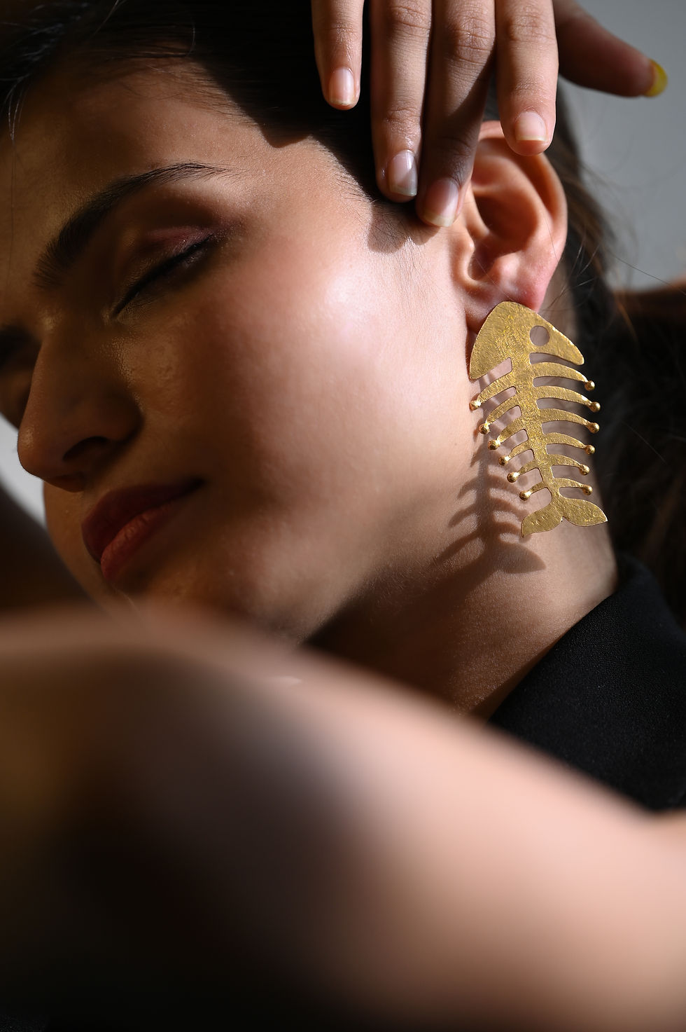 Thumbnail: Edgy fish skeleton earrings in metallic finish – bold and artistic statement jewelry design