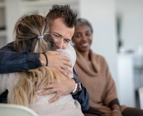 Man hugging a woman in recovery New Life Christian