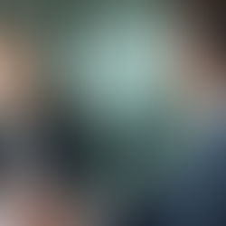 A business man and woman talking at a table