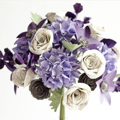This fully custom bridal bouquet was handmade from the book pages of Winnie the Pooh, Pride and Prejudice and Persuasion.

Flower varieties include clematis, lisianthus, hydrangeas, dusty miller, sweet peas, and roses. 

The purple color scheme includes lavender, dark purple, slate gray, sage green and ivory.

Begin your own custom wedding flowers at the link below.