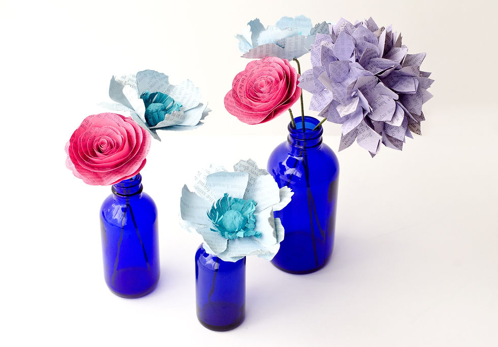 Thumbnail: Three cobalt blue bud vases centerpiece with anemones in light blue and aqua, hot pink roses, and lavender purple hydrangea