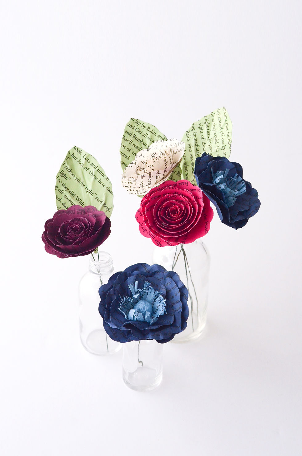 Thumbnail: custom wedding flower centerpiece made from book pages, eco friendly and sustainable wedding decor