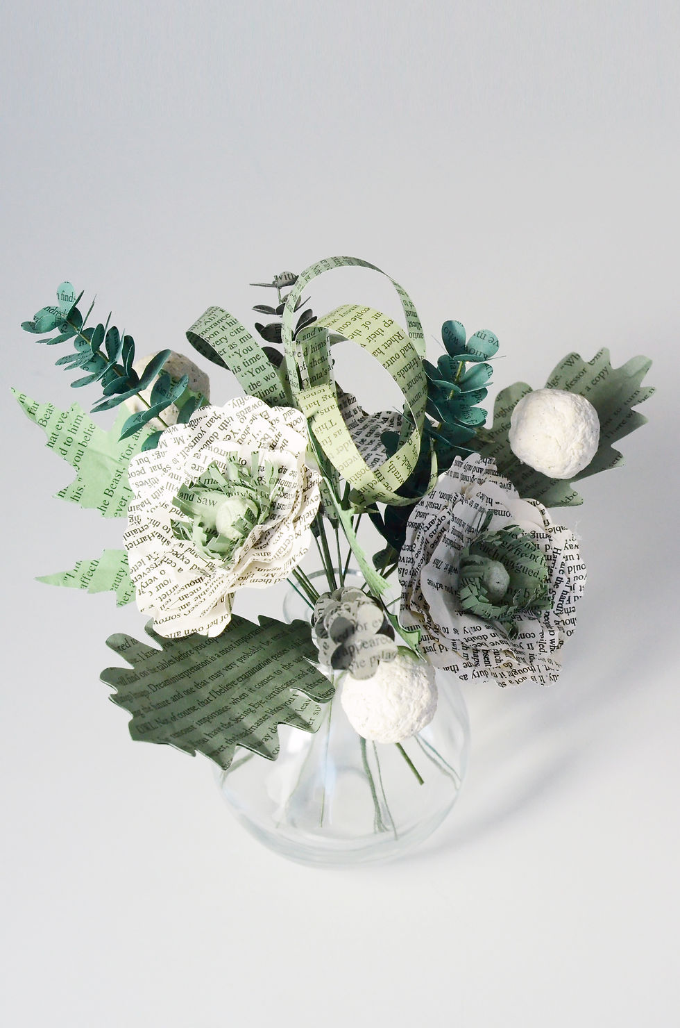 custom book page centerpiece in green and ivory