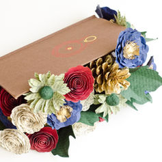 Lord of the Rings book cover filled with colorful paper flowers handmade from LOTR pages.