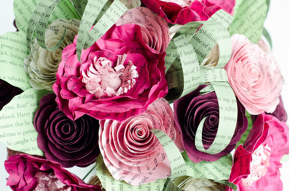 Thumbnail: poppy and rose wedding flowers for book lovers, words from a Harry Potter book can be seen on the flowers