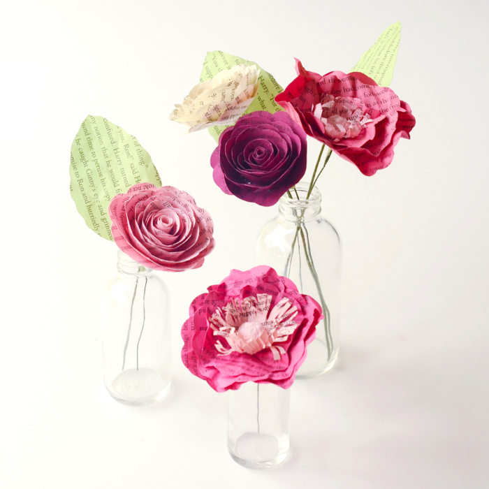 3-vase centerpiece with book page roses and poppies