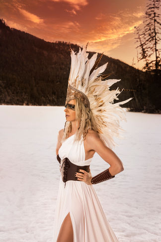 viking warrior feather headpiece white dress sunset Okanagan photo