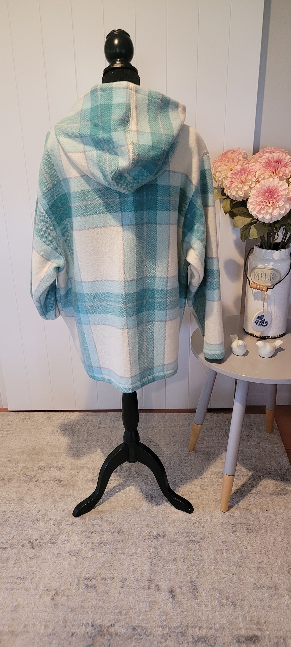 Thumbnail: Back view of the teal and white plaid Charlie Coat on a mannequin