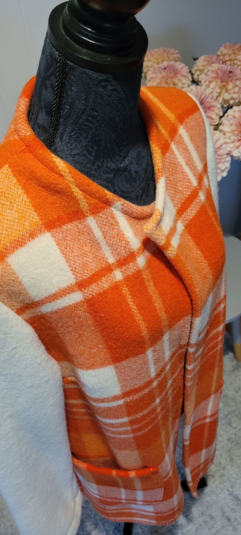 Thumbnail: Close-up of orange plaid Phoebe Coat in medium size