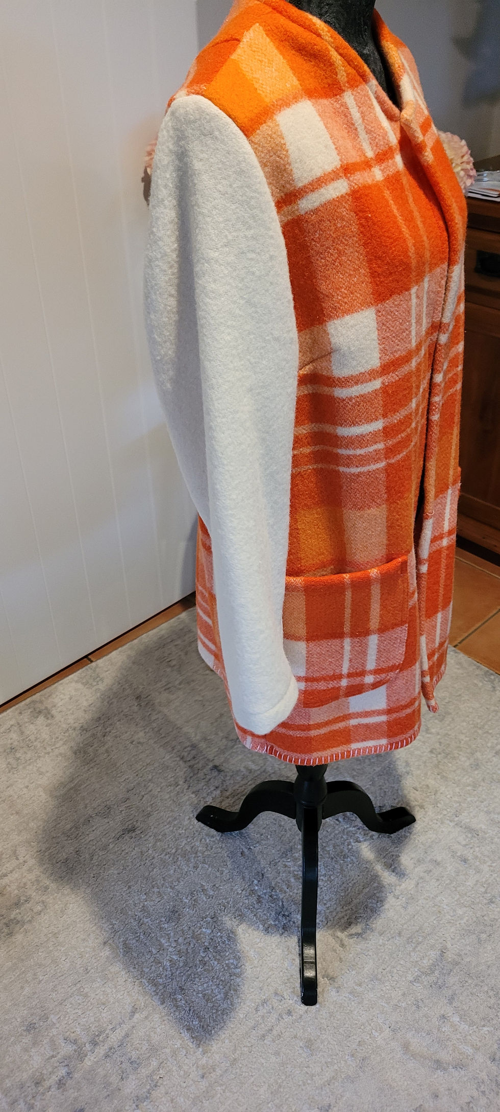 Thumbnail: Phoebe Coat in medium orange plaid on a mannequin