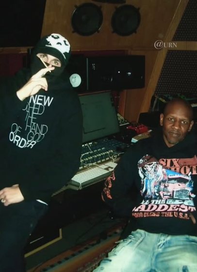 A photograph taken of rapper EsDeeKid in music studio.