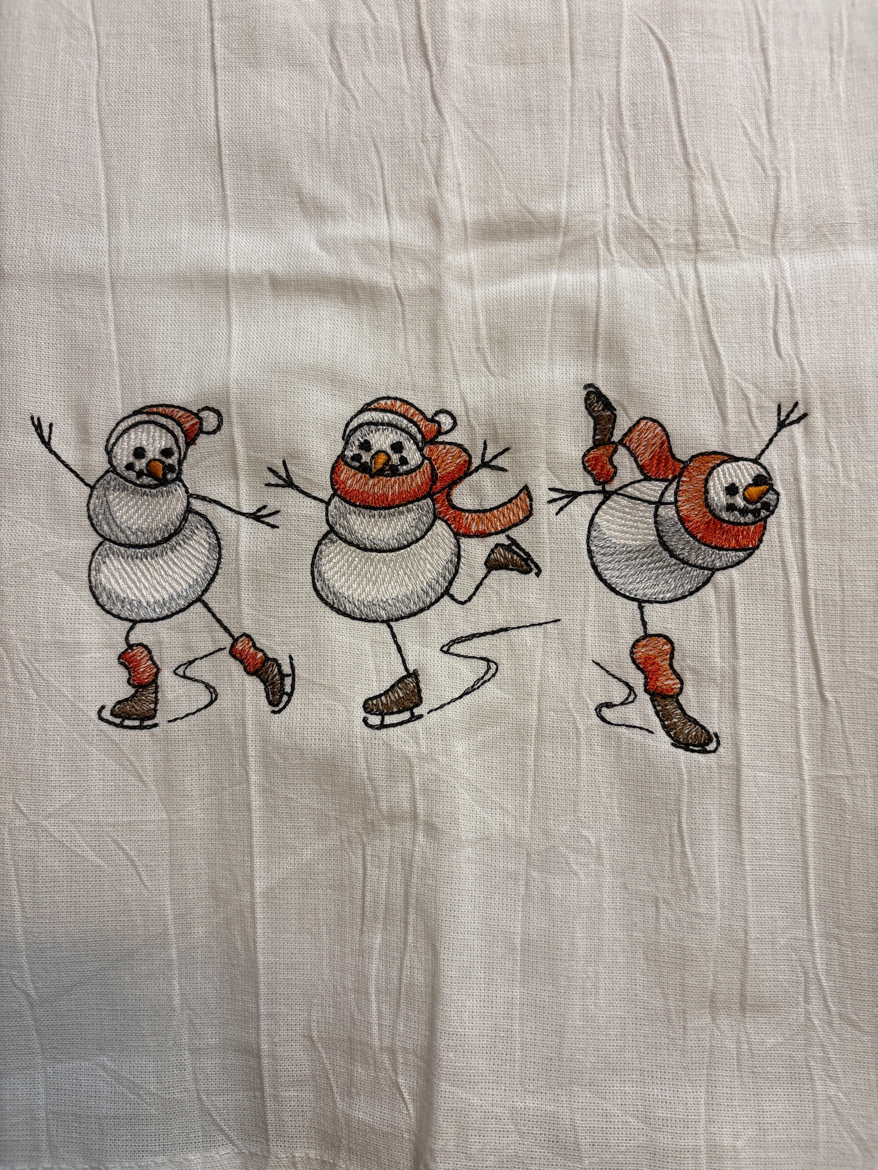 Flour sack tea towel with skating Snowmen