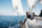 Guests relaxing on Sail Barbary’s electric yacht during a scenic Lake Taupō cruise, enjoying blue skies, calm waters, and sustainable sailing.