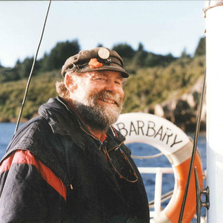 Historic photo of a Barbary captain smiling at the helm