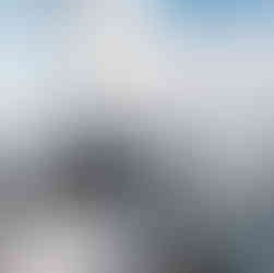 Skipper and passengers sailing aboard the Barbary yacht, pointing out views across the lake.