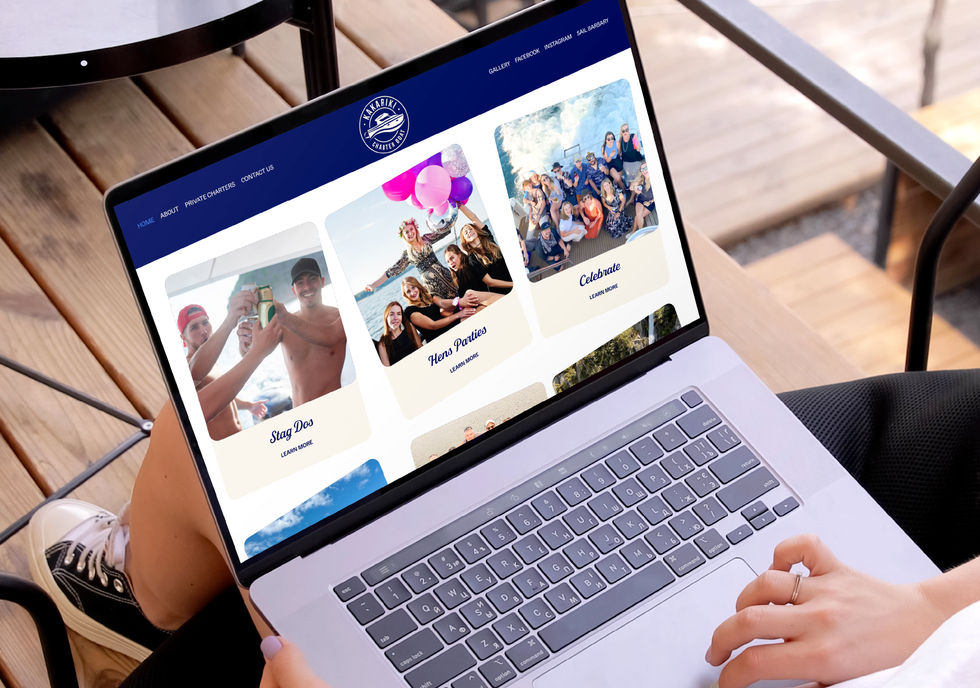 A laptop showing the Kākāriki Charter Boat website tour options, featuring vibrant photography and a fun, modern interface.