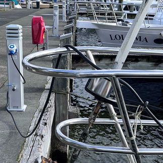 Electric charging station beside the docked Barbary yacht