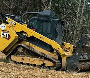 Skid steer and mulching head