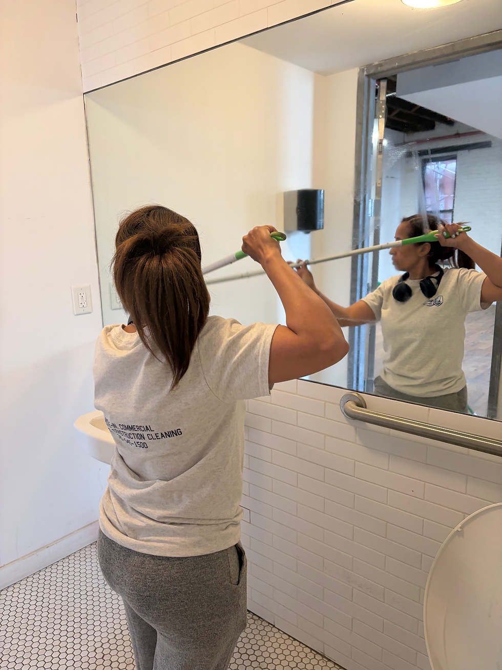 Professional cleaning office restroom mirror