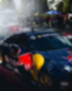 picture of a race car with red bull branding