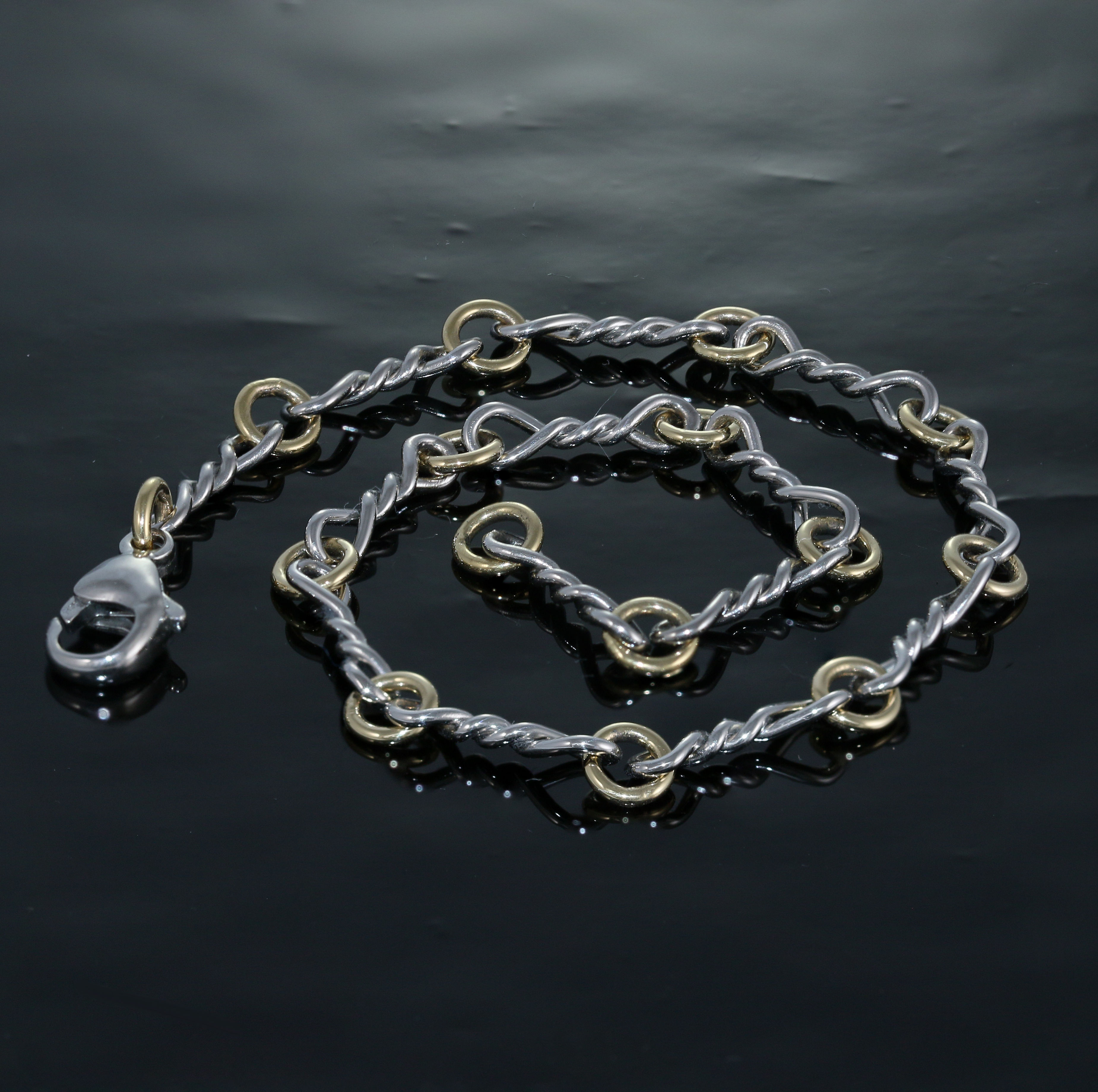 Twist link #3 in Platinum and 18k.