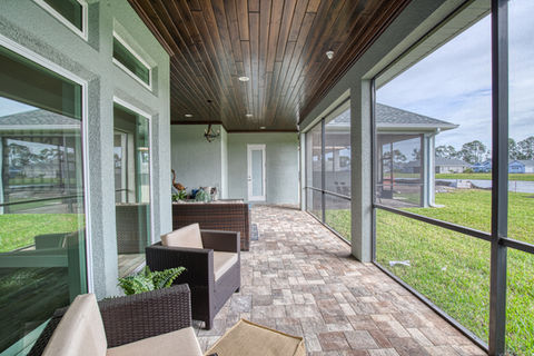 Back porch of luxury Coastal Craftsman Home in Florida