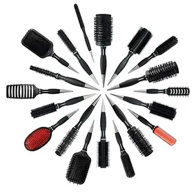 A collection of different hairbrushes laid out in a salon setting, showing options for curly, straight, thick, and afro hair types.