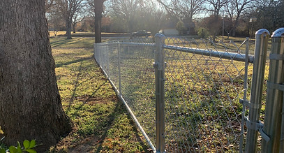 Durant, OK chain link fence with a bottom rail, providing added stability and security for residential and commercial properties.