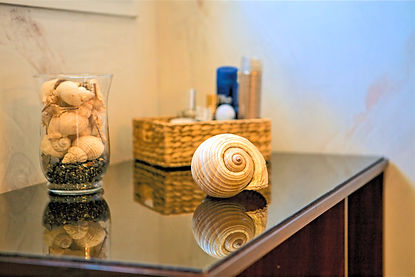 Minimalist Mediterranean decor in the Master Suite, featuring natural seashells as a reminder of the 7-minute walk to the Libyan Sea.