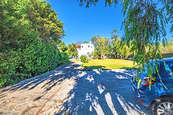 VIP drive-up access and private gravel parking, allowing guests to pull directly up to the main patio of the Grand Estate.